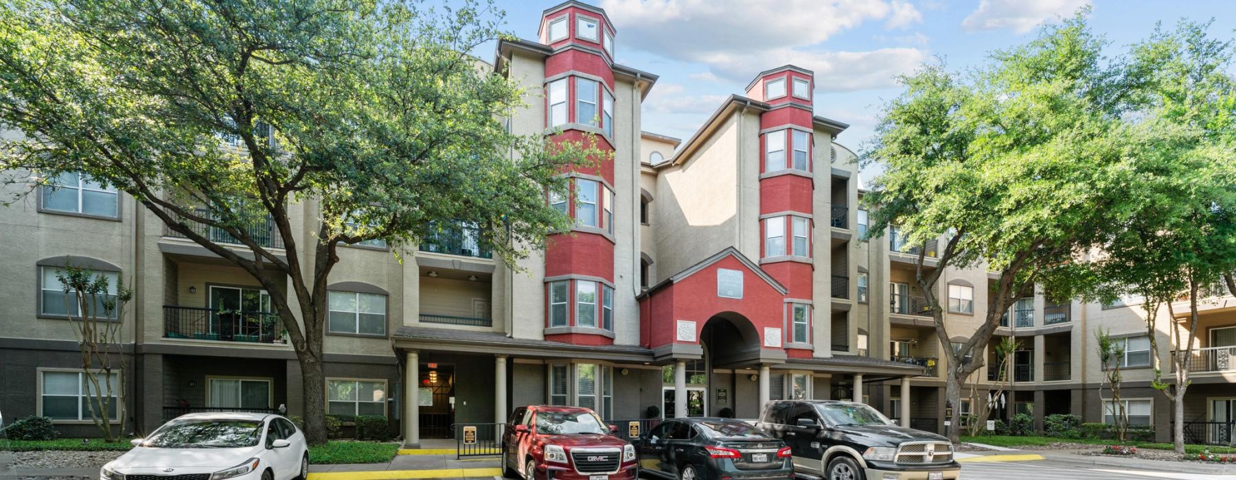 a group of cars parked in front of a building