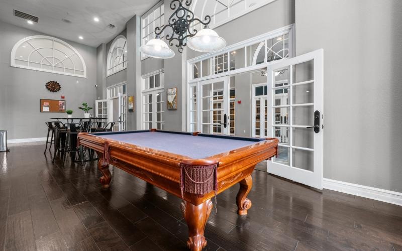 a pool table in a common room